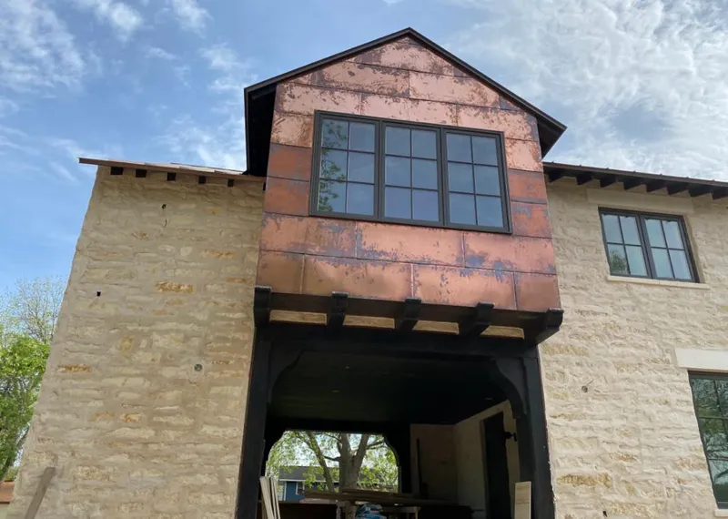 Copper metal panel facade on a stone building for Skylight Installation in Alhambra