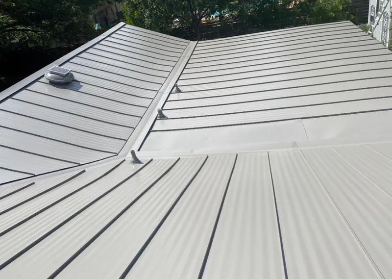 Solar attic fan installed on a metal roof for Roof Ventilation in Alhambra